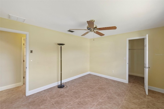 unfurnished room featuring ceiling fan