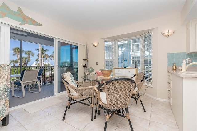 dining area with light tile patterned floors