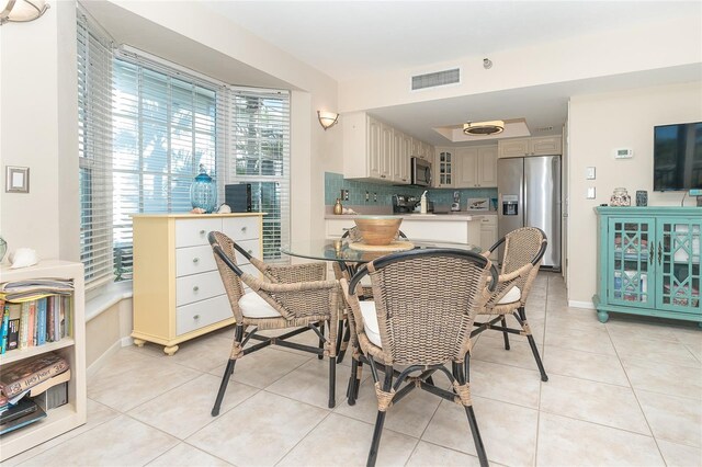 dining area featuring light tile patterned floors