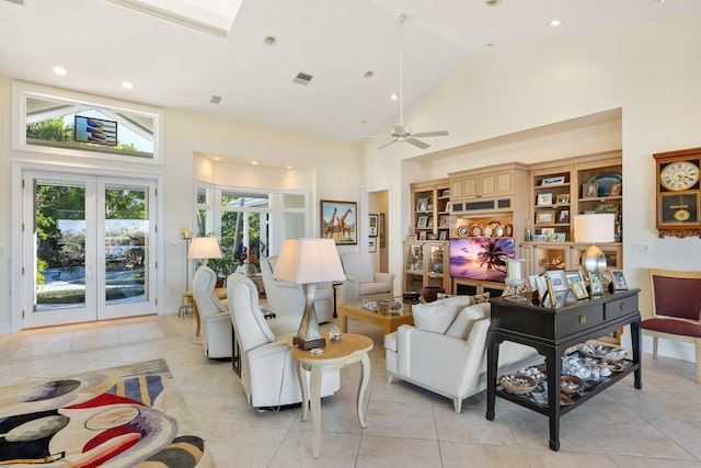 living room with ceiling fan, light tile patterned flooring, high vaulted ceiling, and french doors