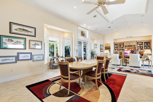 dining room with ceiling fan, light tile patterned floors, and high vaulted ceiling