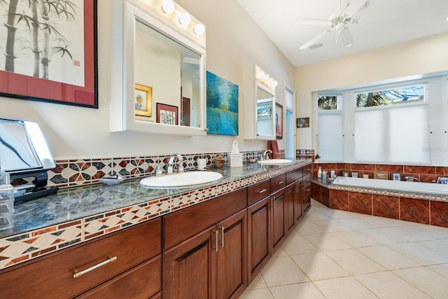 bathroom with vanity, tiled bath, tile patterned floors, and ceiling fan