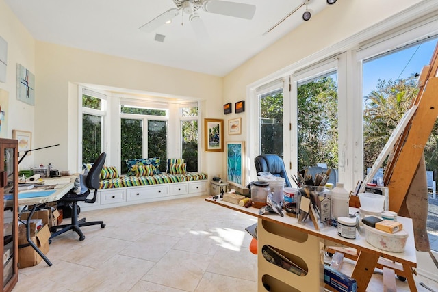 tiled office space featuring plenty of natural light, ceiling fan, and french doors