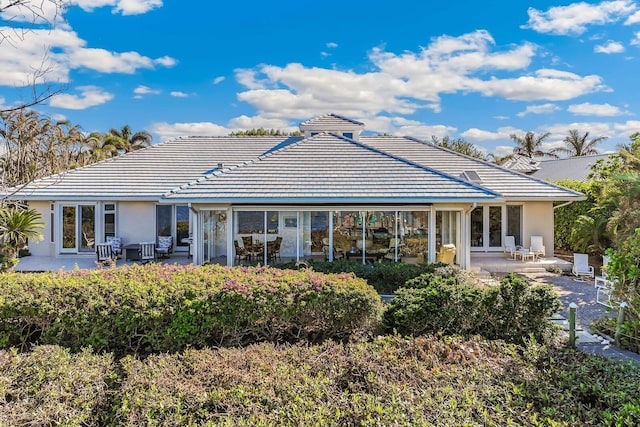 rear view of property with a patio area