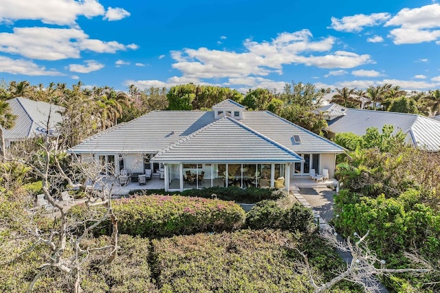 back of property featuring a patio