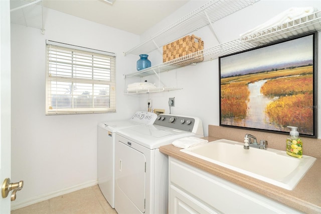 laundry area featuring separate washer and dryer and sink