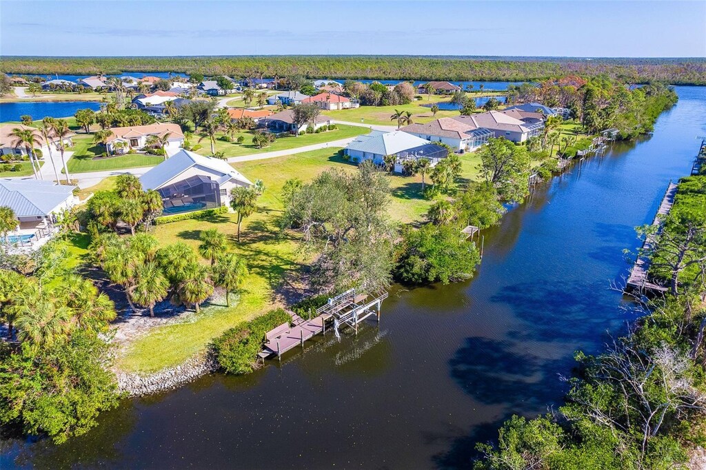 birds eye view of property featuring a residential view and a water view