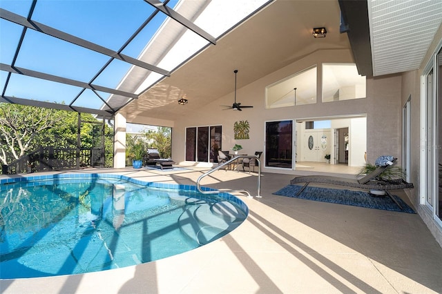 view of pool with a patio, a lanai, ceiling fan, and a jacuzzi