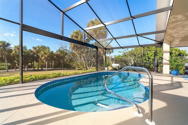 view of swimming pool featuring a lanai and a patio