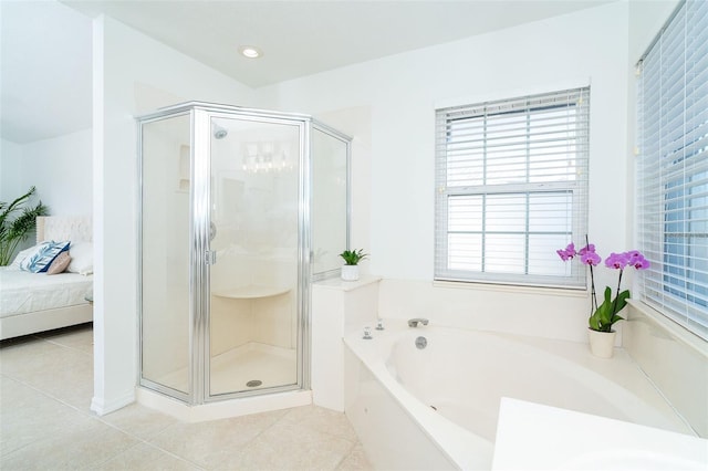 bathroom with separate shower and tub and tile patterned floors