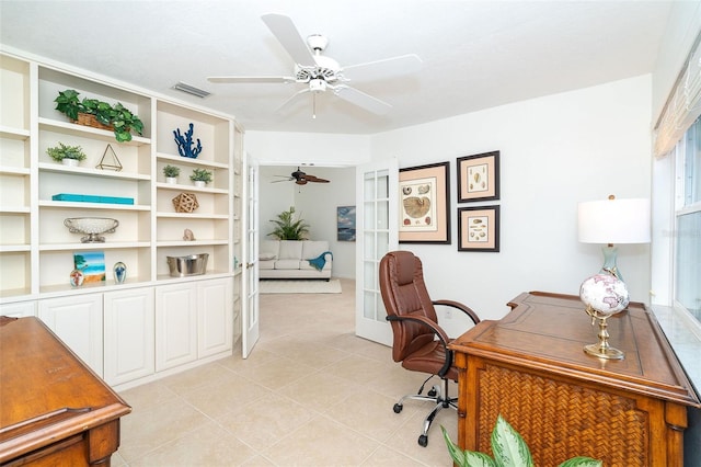 tiled office featuring french doors and ceiling fan