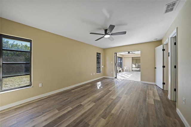 unfurnished room featuring ceiling fan and hardwood / wood-style floors