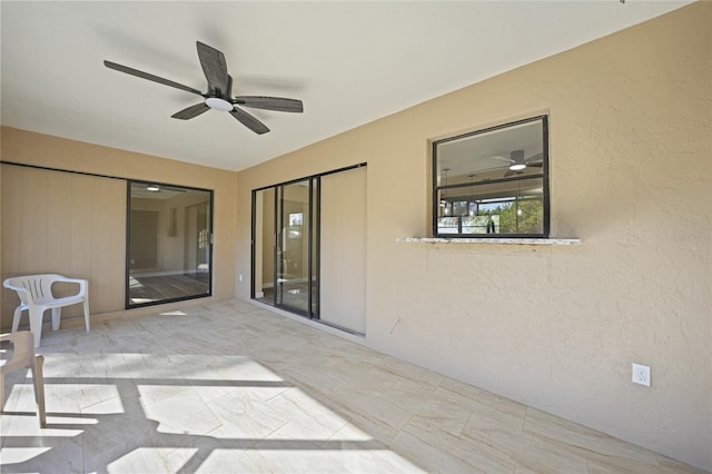 view of patio with ceiling fan