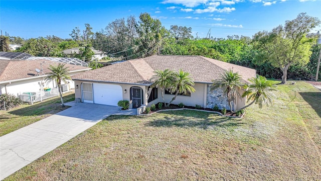 ranch-style home with a front yard and a garage