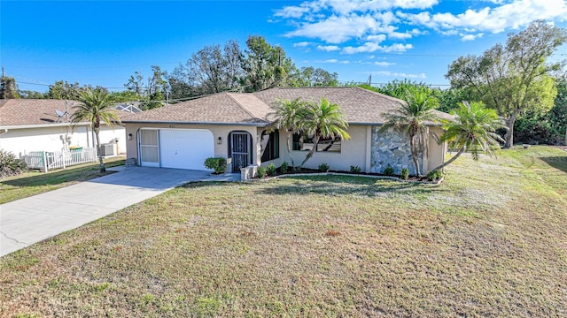 ranch-style house featuring a garage and a front lawn