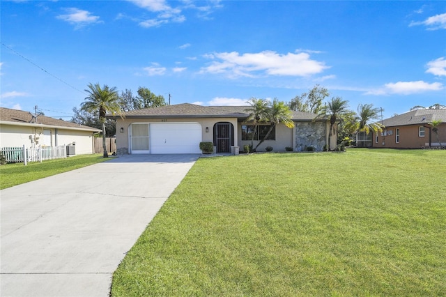 ranch-style home with a front lawn and a garage