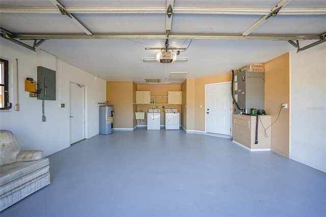 garage featuring a garage door opener, electric panel, sink, water heater, and washing machine and clothes dryer