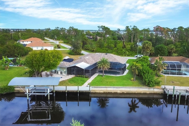 birds eye view of property with a water view