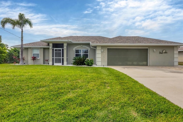 view of front of property with a front lawn and a garage