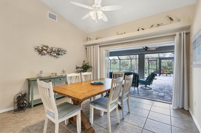 dining space featuring lofted ceiling, ceiling fan, and light tile patterned floors