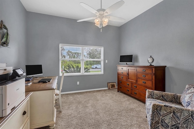 office area featuring light carpet and ceiling fan