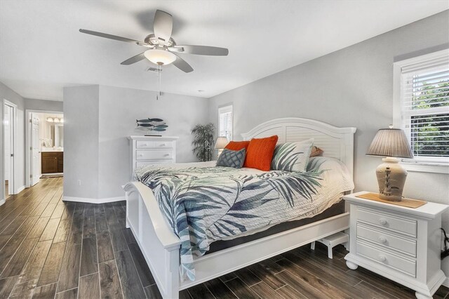 bedroom with ceiling fan and dark hardwood / wood-style floors