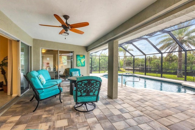 exterior space featuring a patio area, an outdoor living space, and glass enclosure