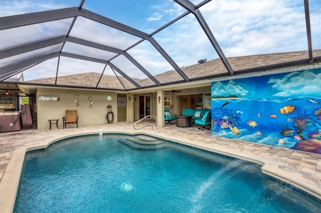 view of pool featuring a patio, pool water feature, and glass enclosure