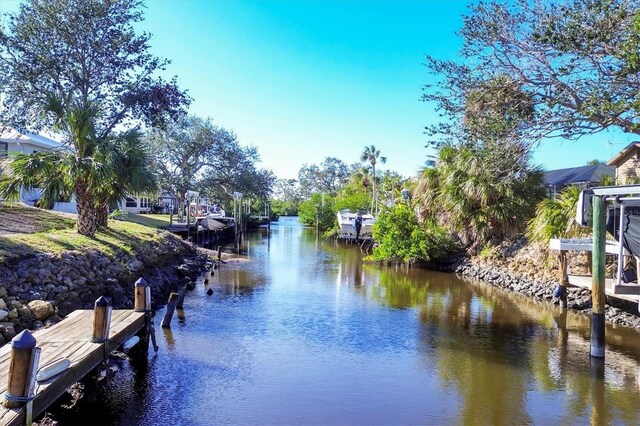 dock area with a water view