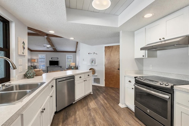 kitchen featuring sink, stainless steel appliances, white cabinetry, and a textured ceiling