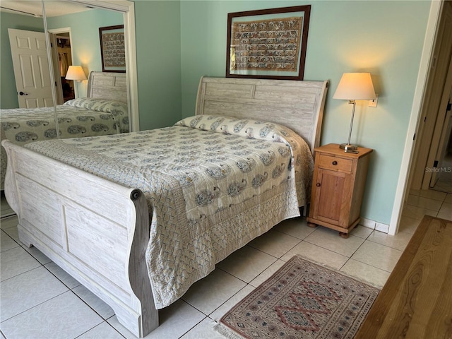 bedroom with light tile patterned floors