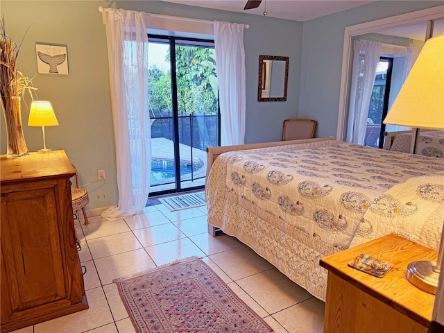 bedroom featuring access to exterior, ceiling fan, and light tile patterned floors