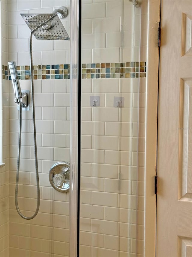 bathroom with tiled shower