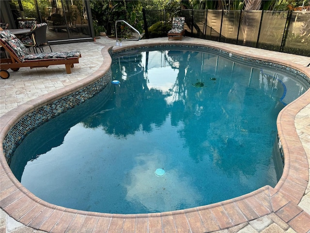 view of pool featuring a patio area