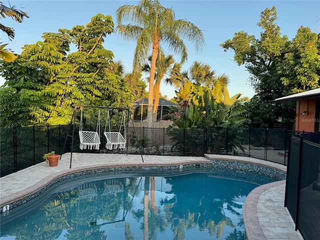 view of swimming pool featuring a patio area