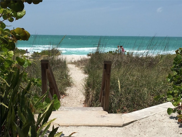 property view of water featuring a beach view