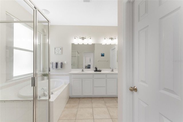 bathroom with tile patterned flooring, vanity, and independent shower and bath