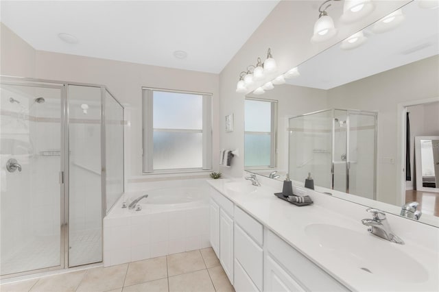 bathroom featuring vanity, tile patterned flooring, and plus walk in shower