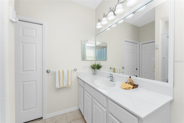 bathroom featuring tile patterned flooring and vanity