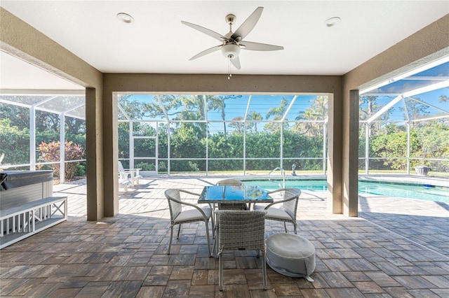 sunroom with ceiling fan, a healthy amount of sunlight, and a swimming pool