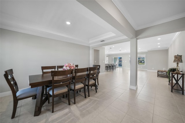 dining room with crown molding and light tile patterned flooring