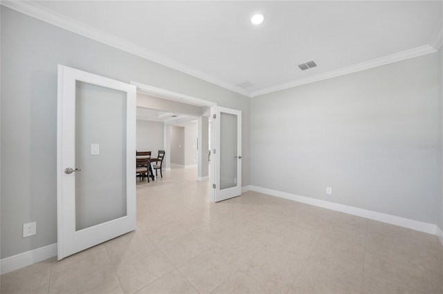 spare room featuring french doors and ornamental molding