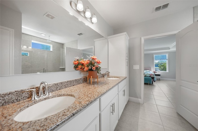 bathroom with vanity, tile patterned floors, and an enclosed shower