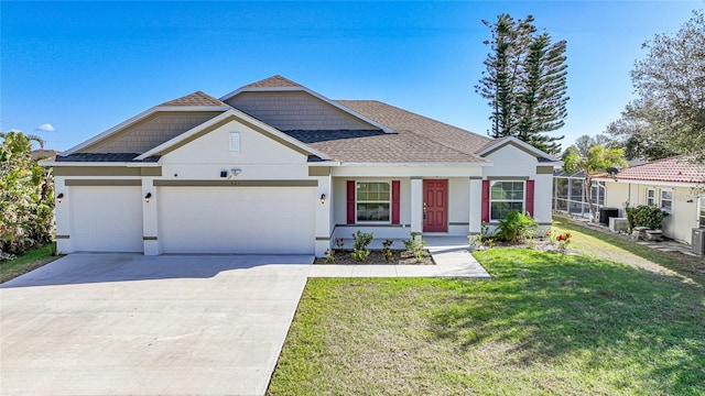 view of front of property with a garage and a front lawn