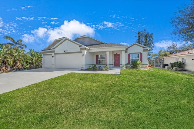 view of front of property featuring a garage and a front lawn