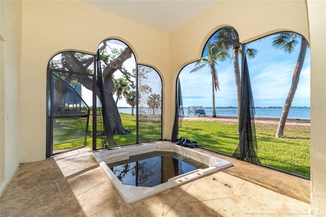 interior space featuring a water view and a yard