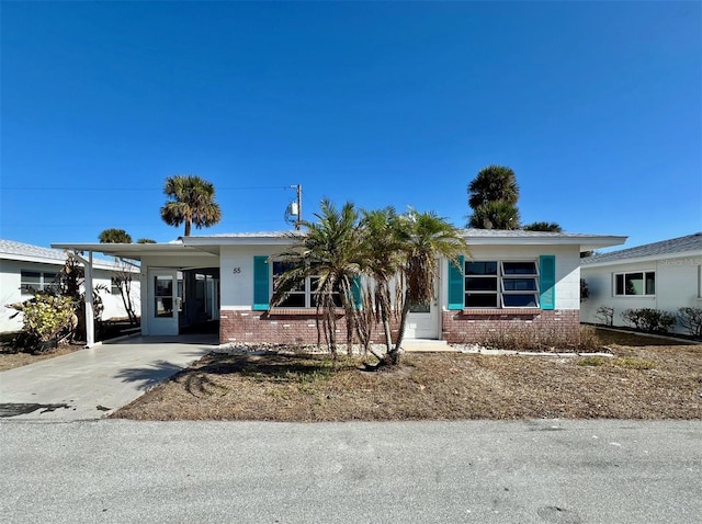 single story home with a carport