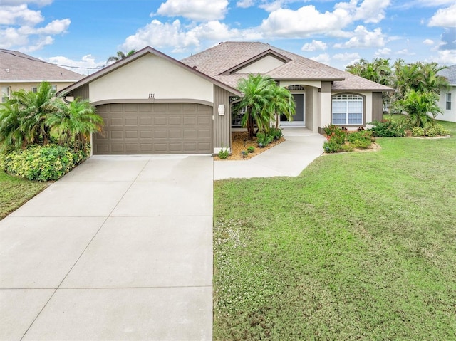 view of front of home featuring a garage and a front lawn