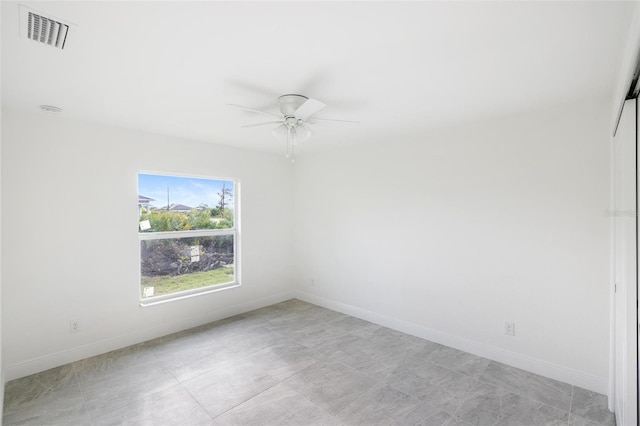 empty room featuring ceiling fan