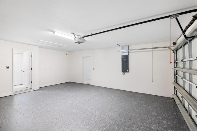 garage with electric panel and a garage door opener